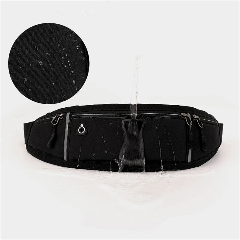 Black waterproof running belt with zip pockets, headphone port, and reflective trim, shown with water being poured.