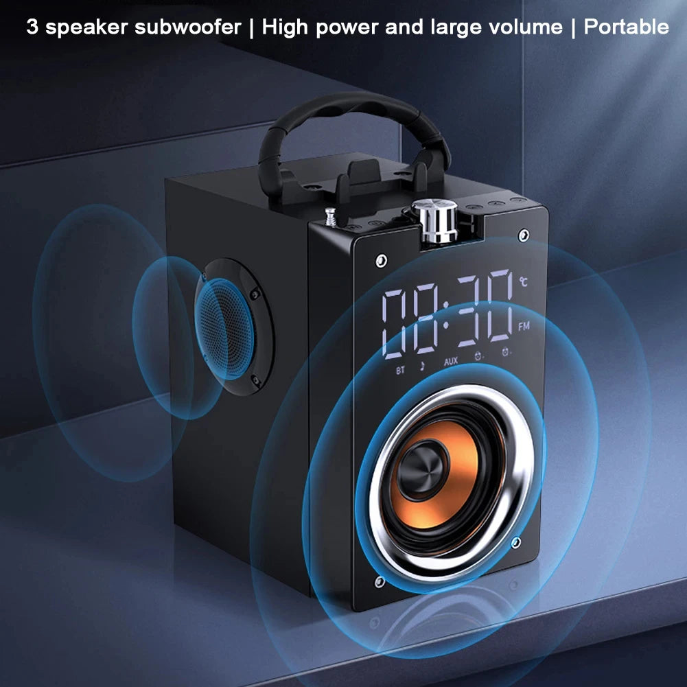 Portable black wireless speaker with digital clock, carry handle, and exposed orange subwoofer driver.