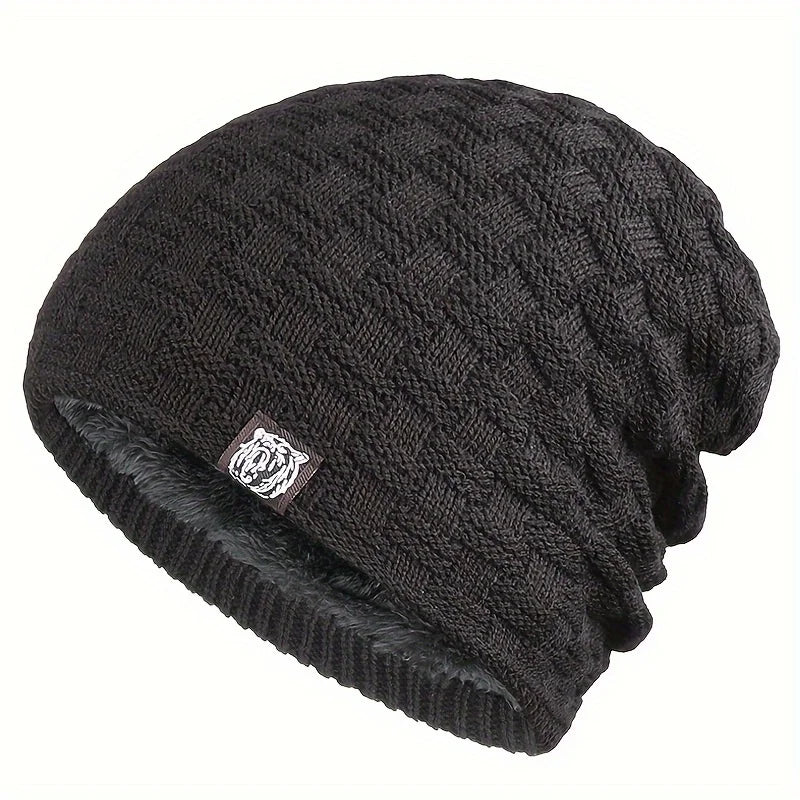 Men’s black knitted beanie with a textured cable pattern, fleece lining and a small rectangular logo patch.
