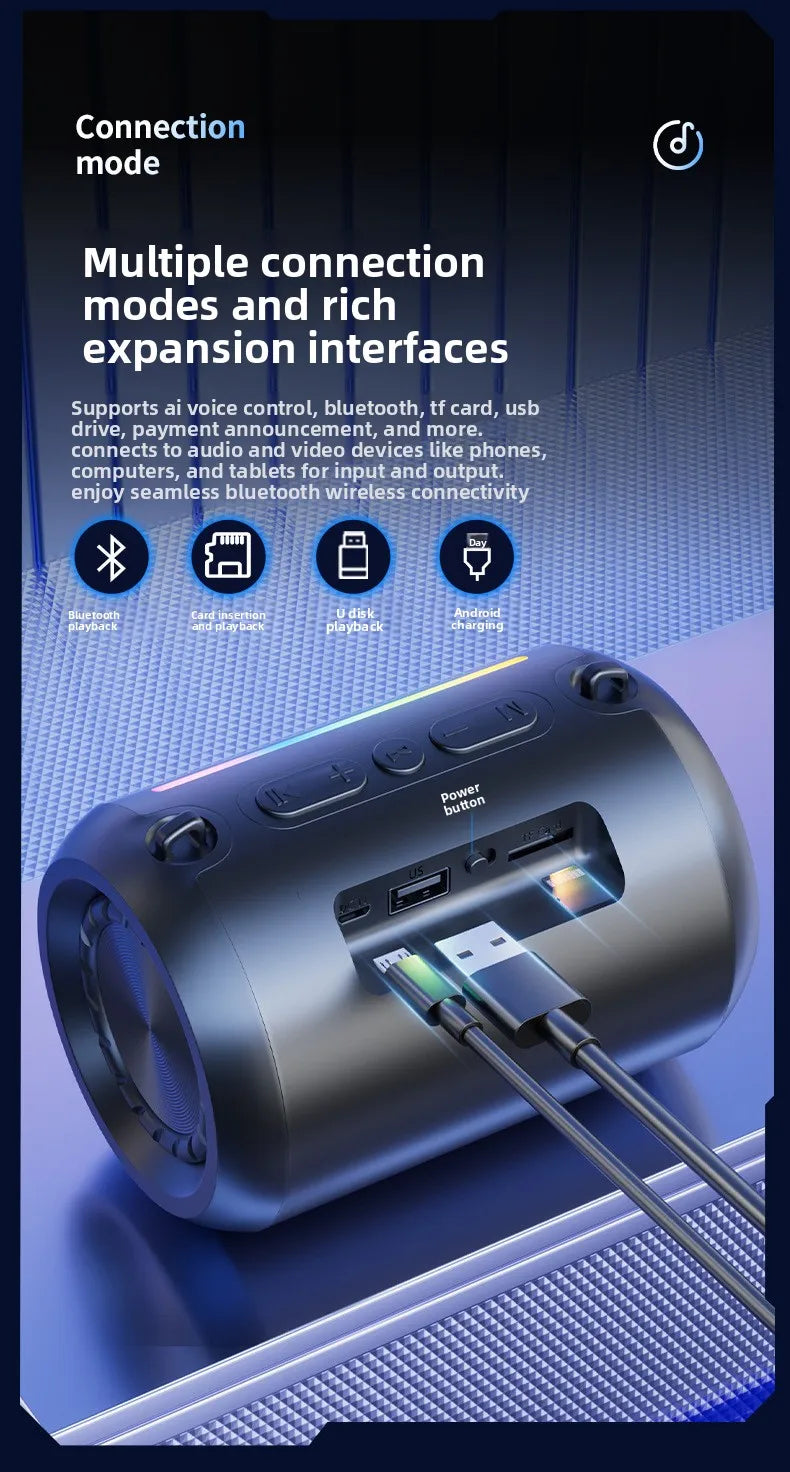 Portable dark grey cylindrical Bluetooth speaker with RGB lighting, featuring multiple ports for versatile connectivity.