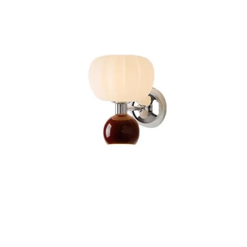 Modern wall lamp with a ribbed cream glass shade, brown base, and chrome wall mounting.