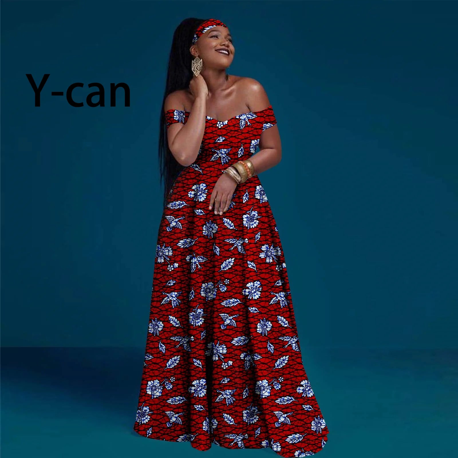Model wears an off-the-shoulder red floral print maxi dress with matching headband, featuring a vibrant lattice pattern.