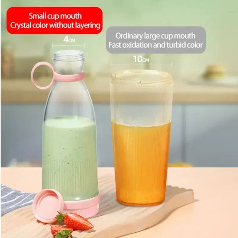 A clear, slim blender bottle with a pink handle and base, alongside a wider glass containing orange juice.