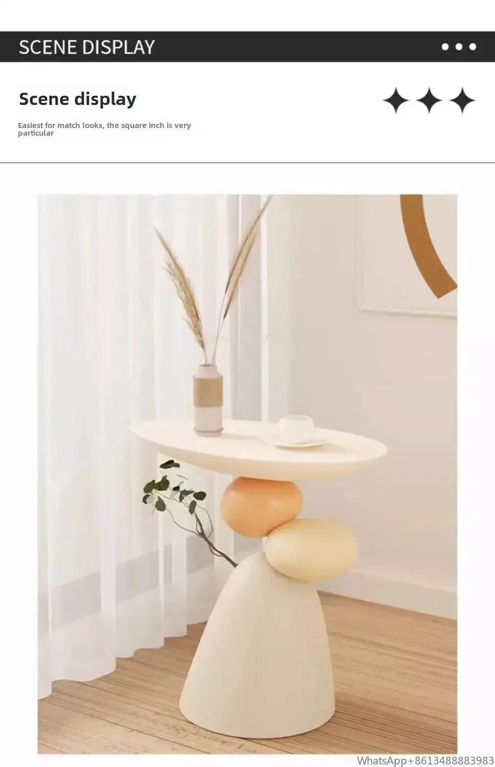 Minimalist cream-coloured side table with a sculptural, stacked stone base design in a bright, modern room.