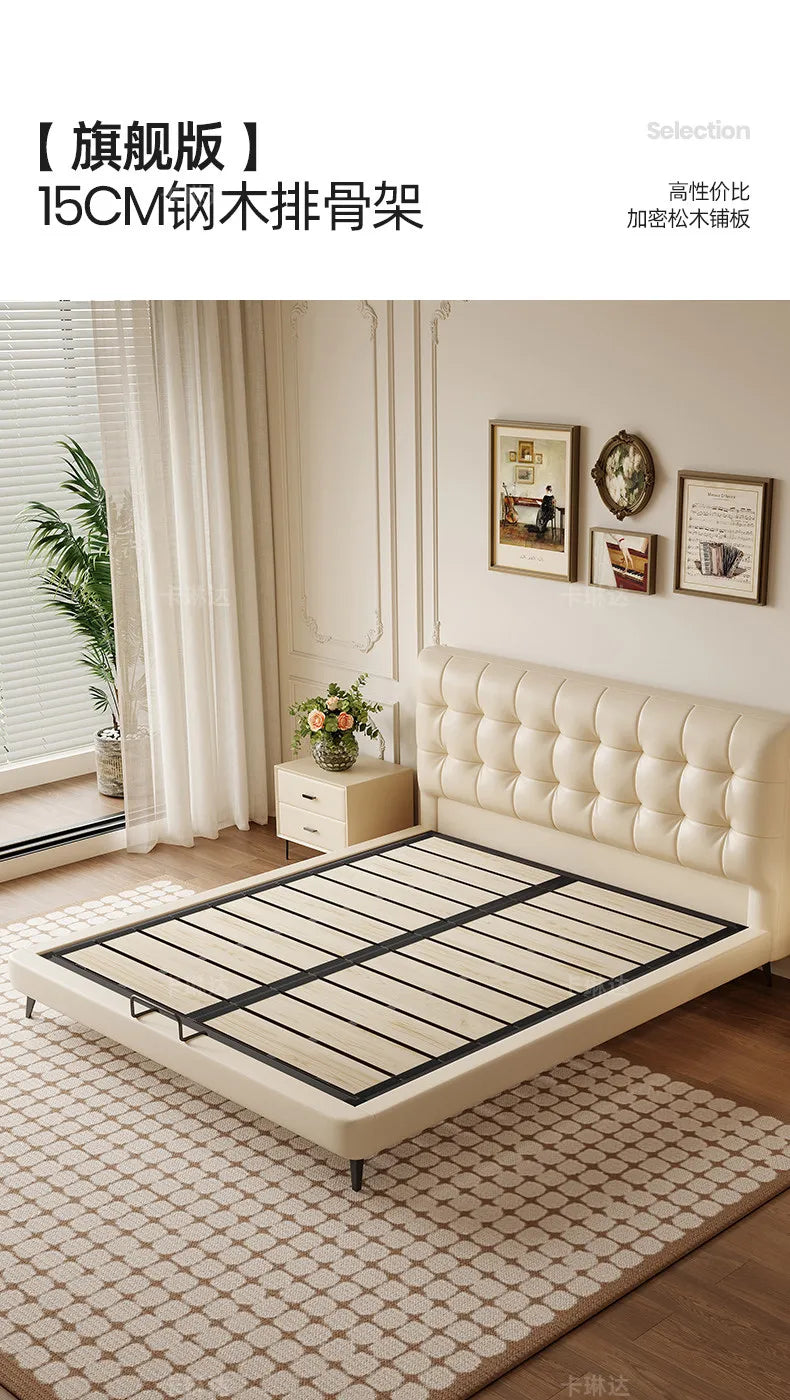 Minimalist cream bed frame with a tufted headboard and wooden slatted base in a bright, modern bedroom.