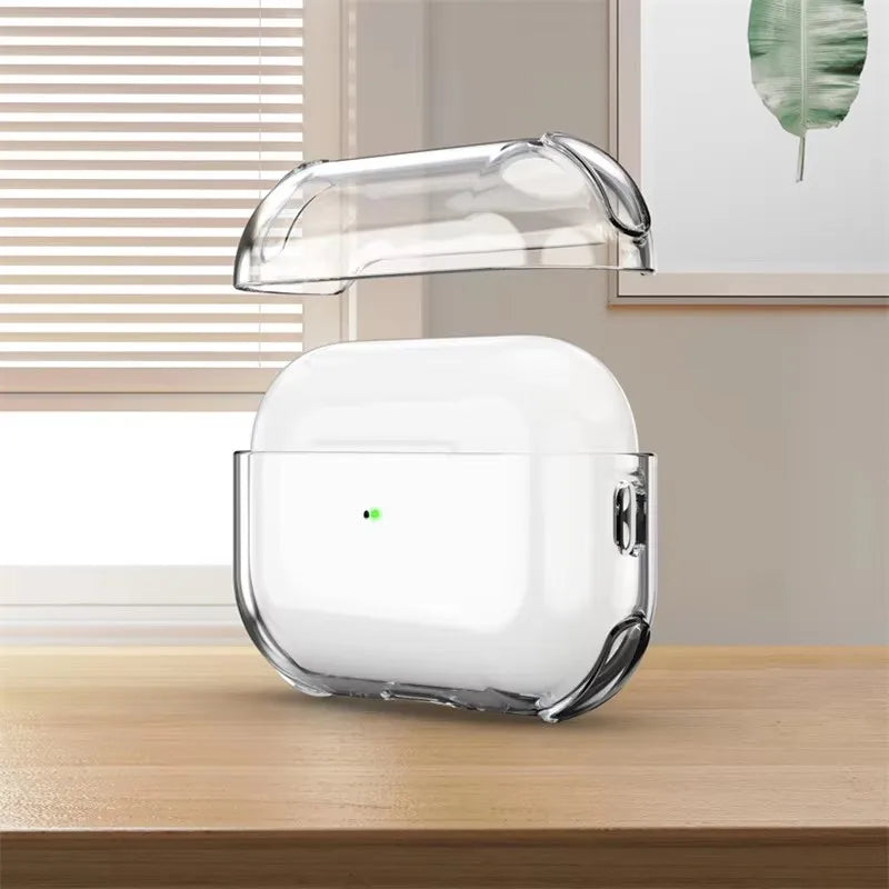 Clear transparent protective case for AirPods Pro, shown with lid detached on a wooden desk.