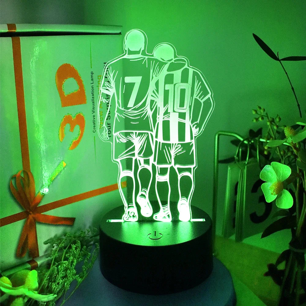 3D LED night light in green, featuring a football-themed design of two players with numbers 7 and 10 on a black base.