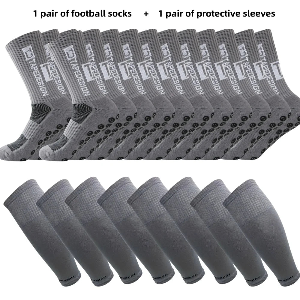 Grey football set featuring grip-sole crew socks and matching elasticated protective calf sleeves for sports performance.