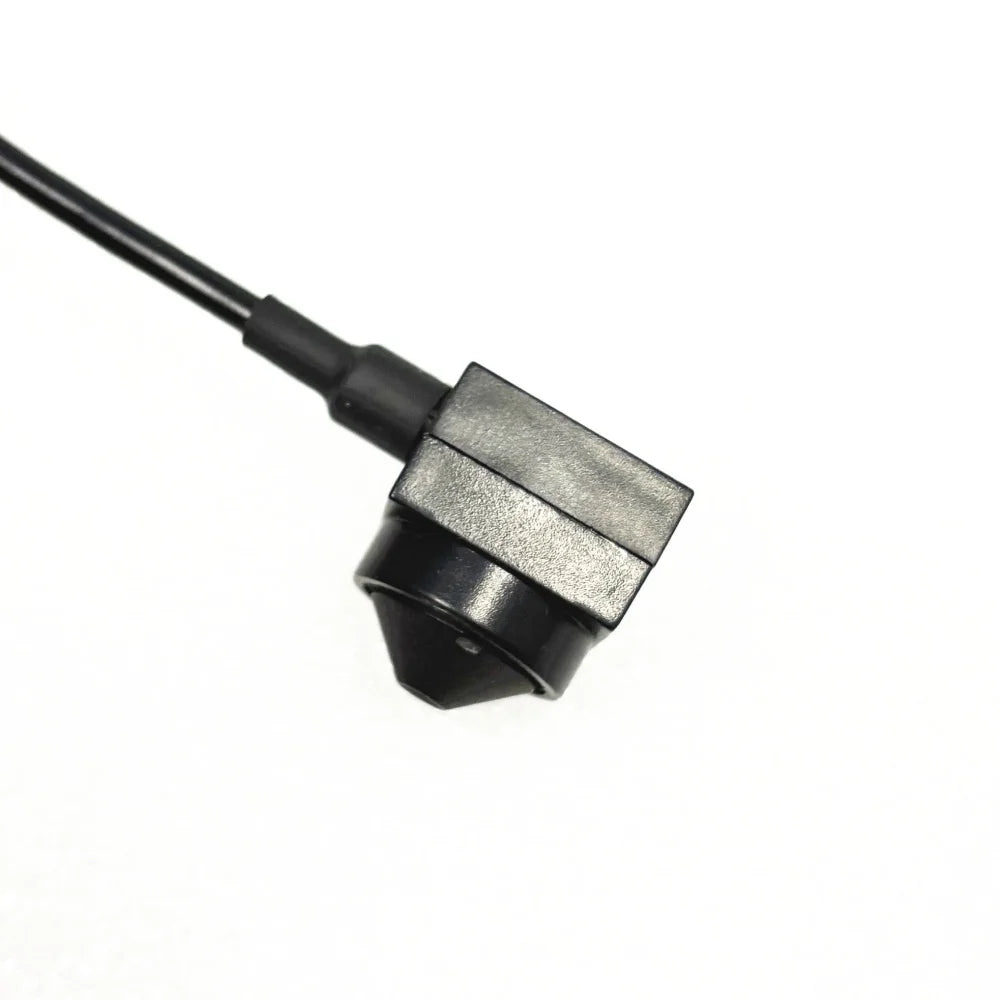 Black, right-angle, plastic backup camera with an attached wiring cable on a white background.