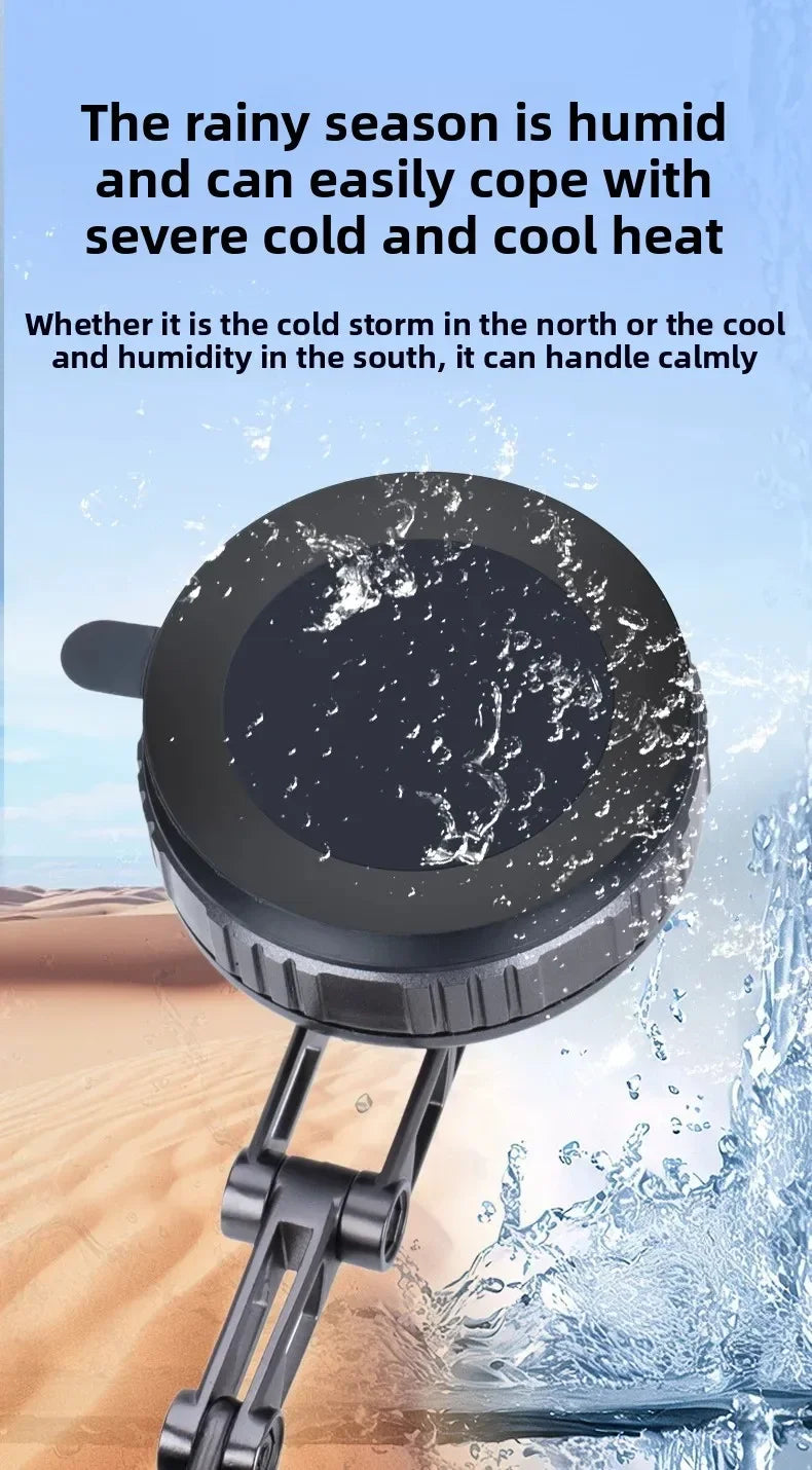 A black, circular device with a foldable arm, set against a desert and water splash background.