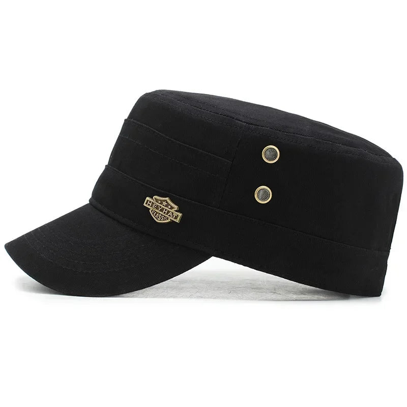 Black cotton military-style cadet cap with a flat top, short peak, and decorative gold-tone side studs.