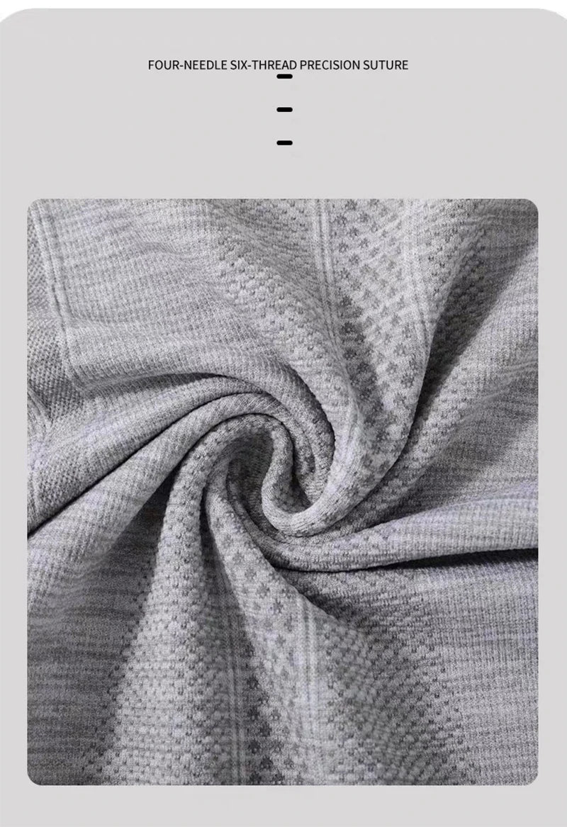 Close-up of soft grey, textured athletic fabric featuring four-needle six-thread precision stitching.