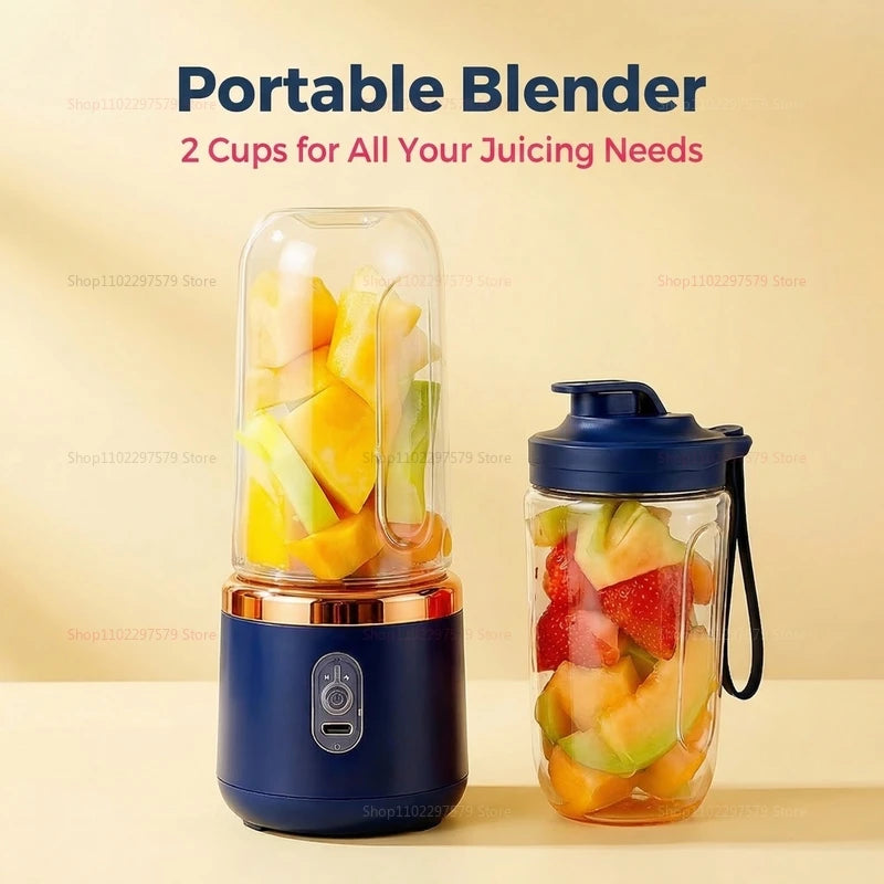 Portable navy blue blender with gold trim and two clear cups filled with cut fruit, on a beige background.