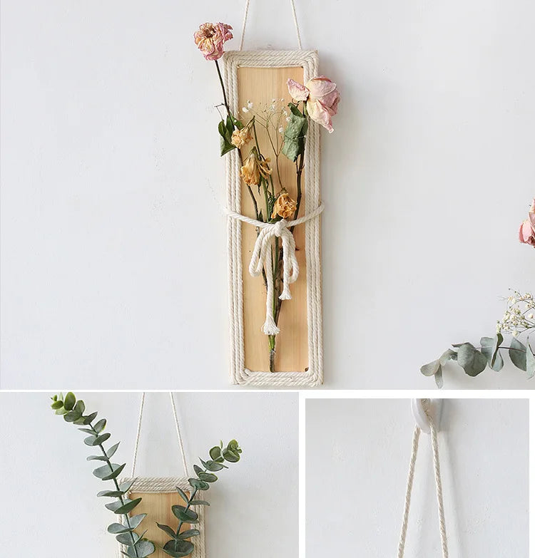Bohemian wall hanging featuring a rectangular wooden plaque with rope edging, displayed with dried flowers.