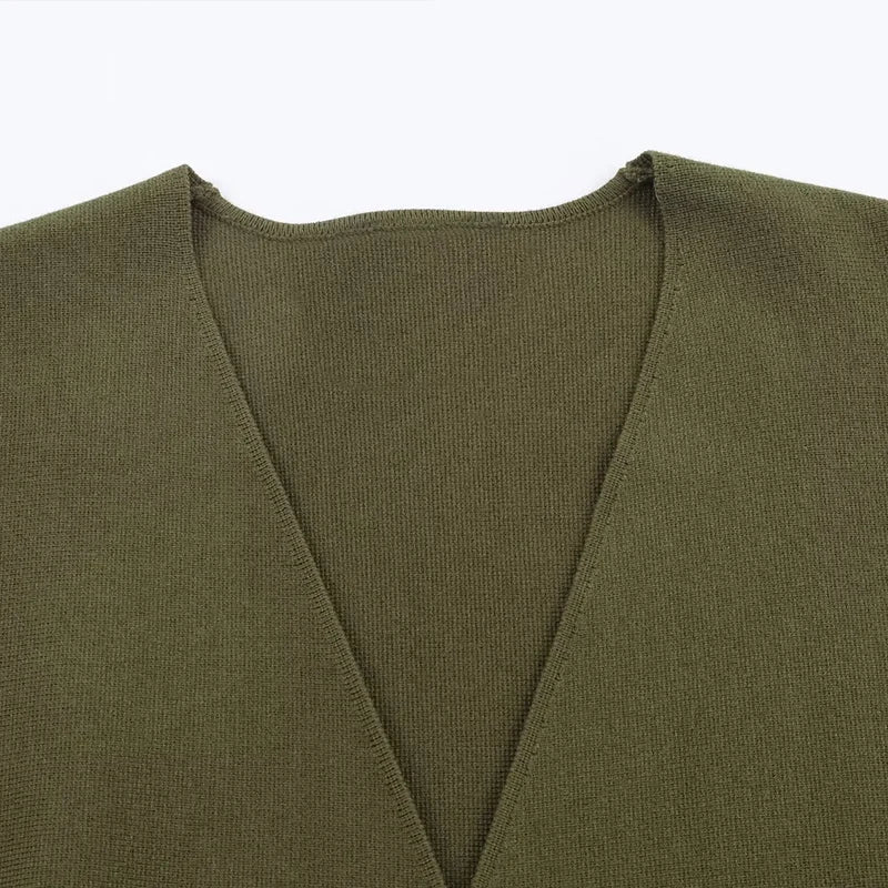 Olive green knit vest with a deep V-neckline and fine-gauge ribbed trim.