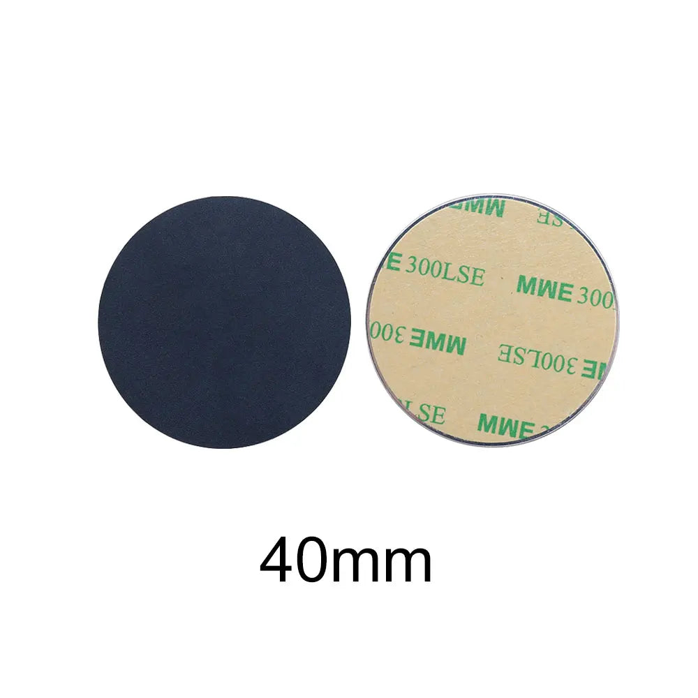Two 40mm round adhesive pads: one showing the black textured front, the other showing the tan adhesive backing.