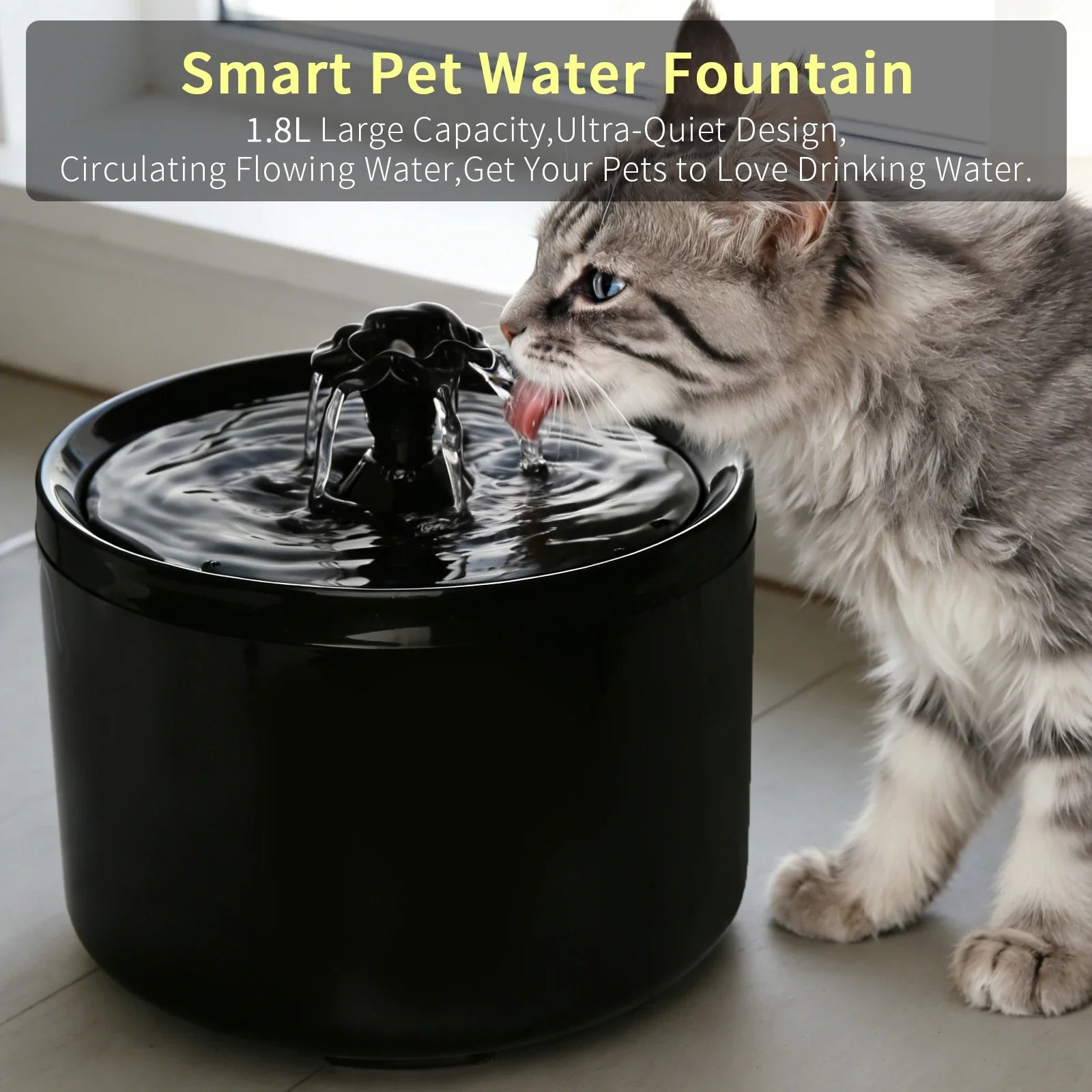 A fluffy tabby cat drinks from a sleek, circular black automatic pet water fountain with a flowing centre spout.