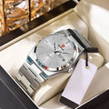 Ultra-thin silver quartz watch with a matching steel link strap, sunray dial, and a day-date display in a gift box.
