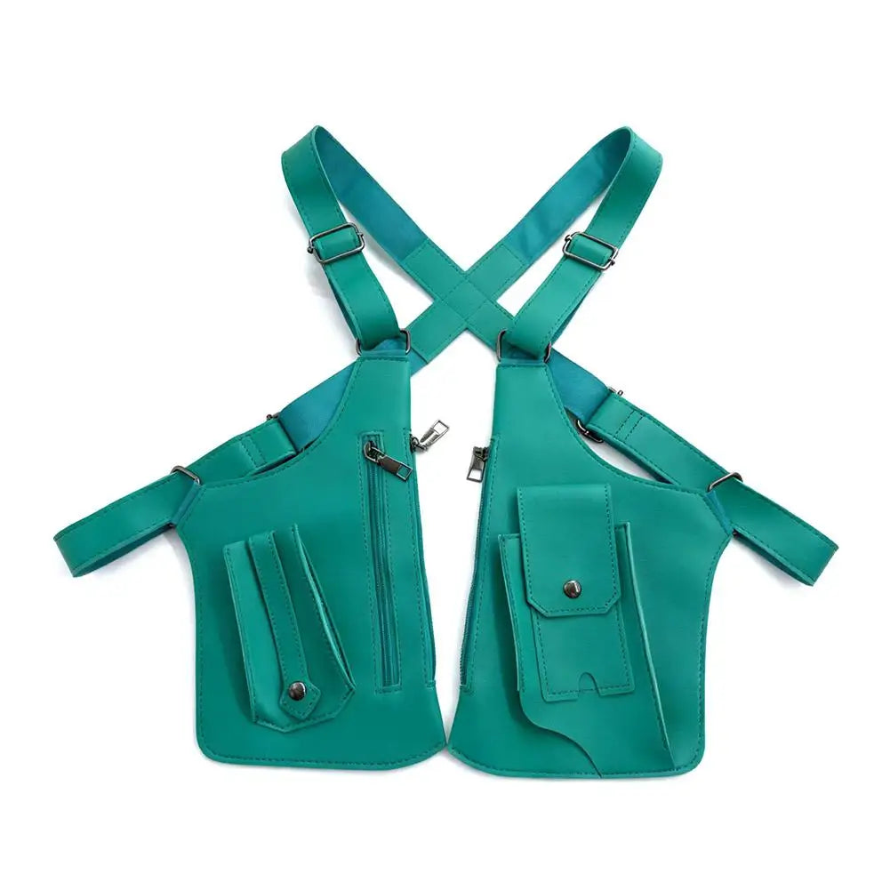 Teal tactical shoulder harness bag with multiple zipped pockets, popper closures and adjustable straps.