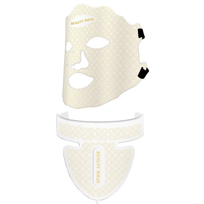 White and gold patterned LED face and neck beauty mask with black straps against a white background.