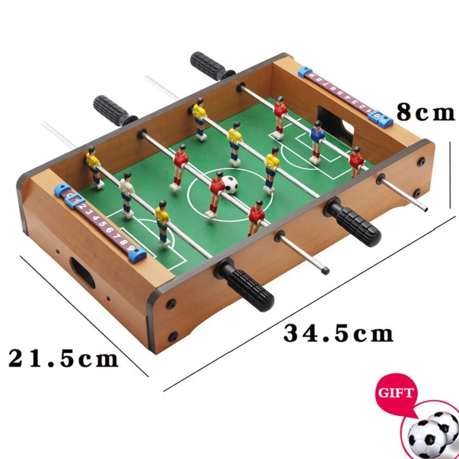 Compact wooden tabletop foosball game with green pitch, sliding scoreboards, and colourful player figures.