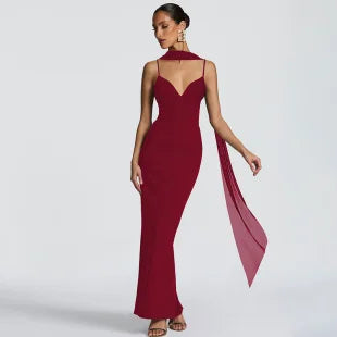 Burgundy maxi dress with spaghetti straps, sweetheart neckline, and a matching sheer scarf detail.