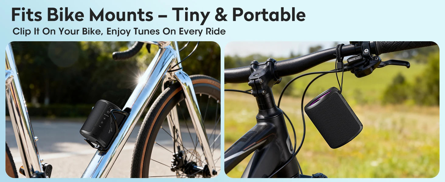 Compact black portable speaker mounted to a bicycle frame and hanging from handlebars for outdoor use.