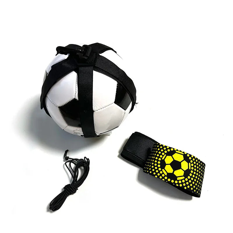 Black and white football with a training harness, elastic cord, and a yellow-patterned waist belt.