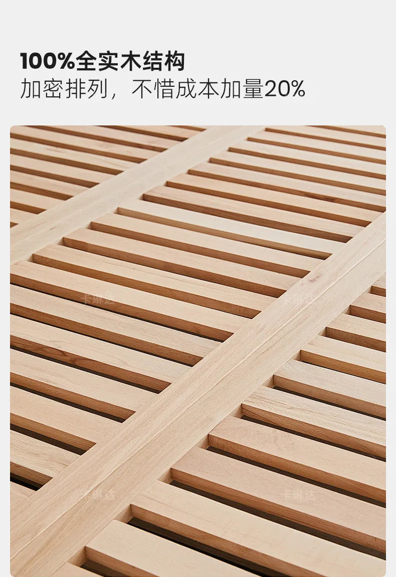 Close-up of a minimalist cream wooden bed frame showing sturdy, closely spaced solid wood slats for extra support.