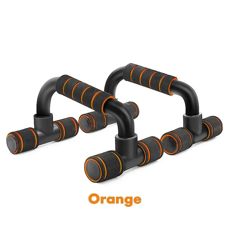 Pair of black and orange push-up bars with padded foam handles and non-slip bases against a white background.