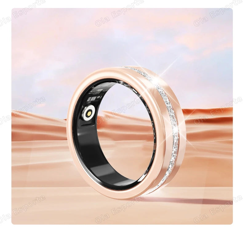 Rose gold smart fitness ring with an embedded row of crystals and black interior sensors, set against a desert backdrop.