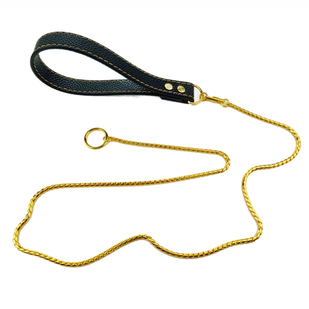 Gold metal dog leash with a black leather handle and integrated slip ring.