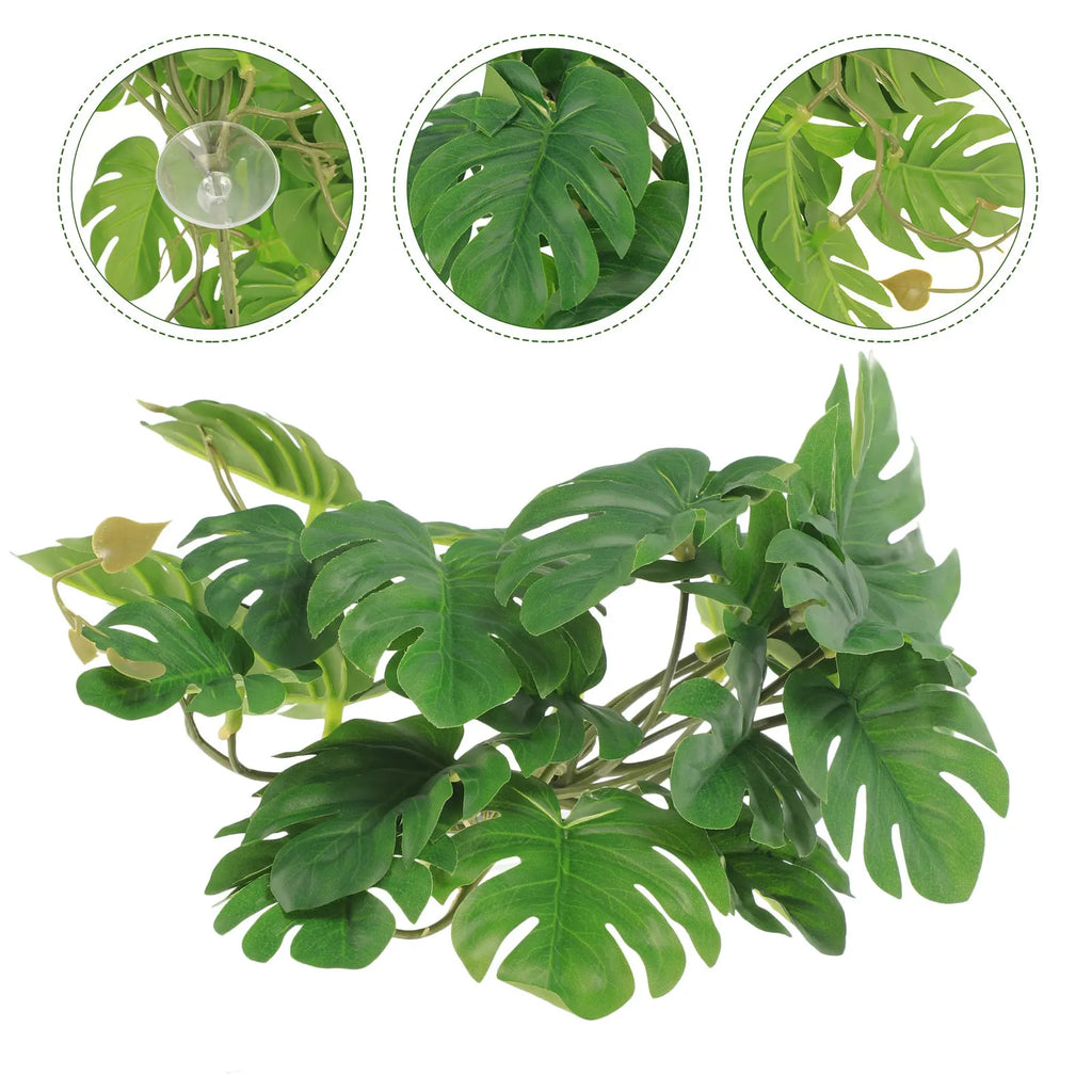 Artificial monstera reptile plant with realistic green leaves and a clear suction cup for terrarium mounting.
