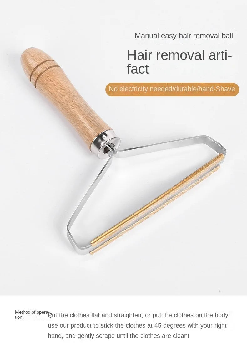 Manual fabric lint remover with a wooden handle and triangular silver metal head featuring a brass scraping edge.