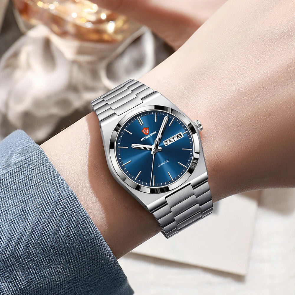 Ultra-thin women's quartz watch with a silver stainless steel strap and a round, metallic blue face with day-date.