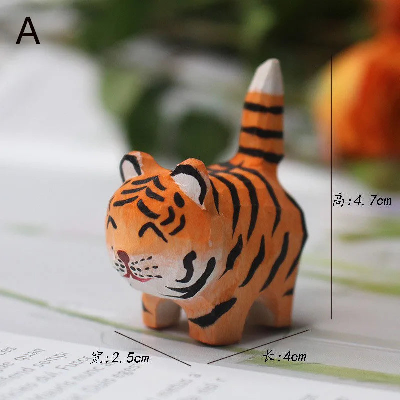 Small, hand-carved wooden tiger figurine with orange fur, black stripes, and a charming, smiling expression.