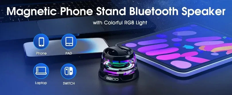 Black portable Bluetooth speaker with integrated phone stand and colourful RGB lighting, set on a desk with devices.