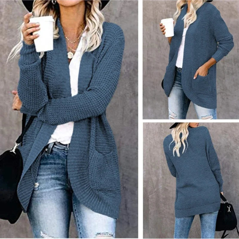 Blue open-front knit cardigan sweater with long sleeves, draped lapels, and two front patch pockets.