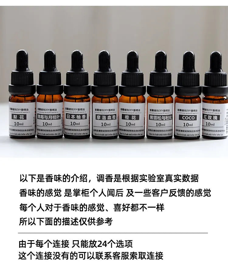 Eight 10ml amber glass essential oil bottles with black dropper caps, arranged in a row against a light background.
