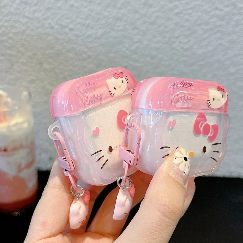 Clear pink Hello Kitty silicone AirPods case with a matching charm clip, suitable for standard AirPods models.