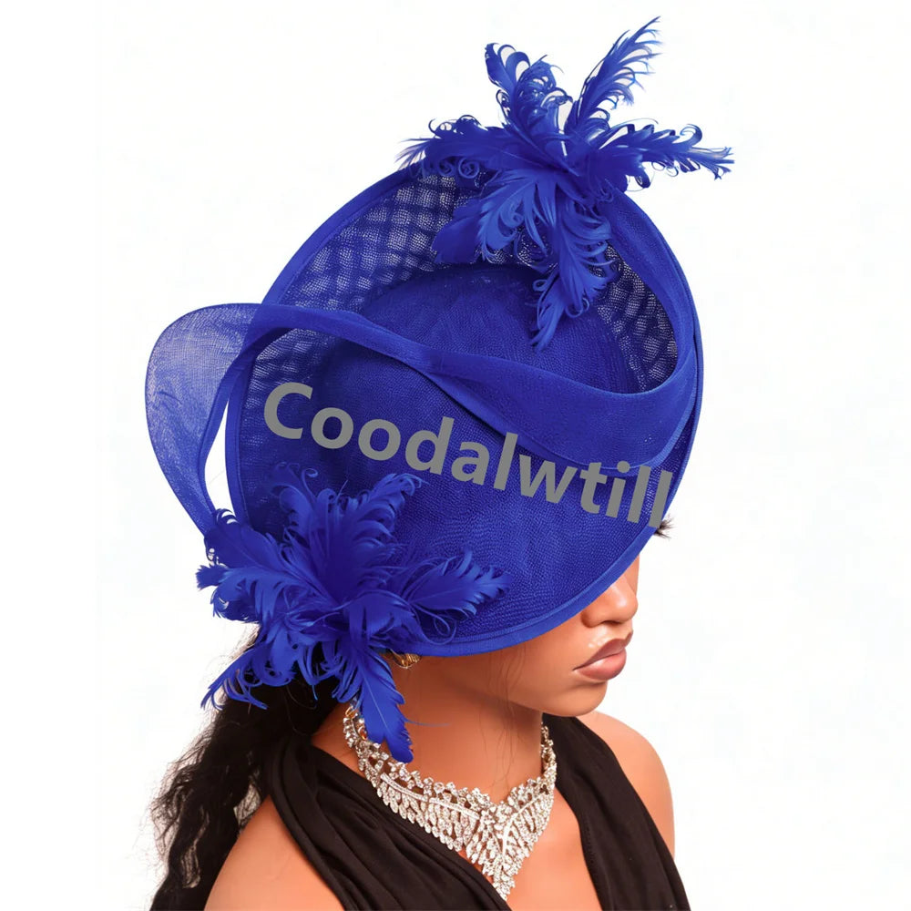 Elegant royal blue fascinator hat featuring structural sinamay mesh, layered ribbon loops, and decorative feathers.