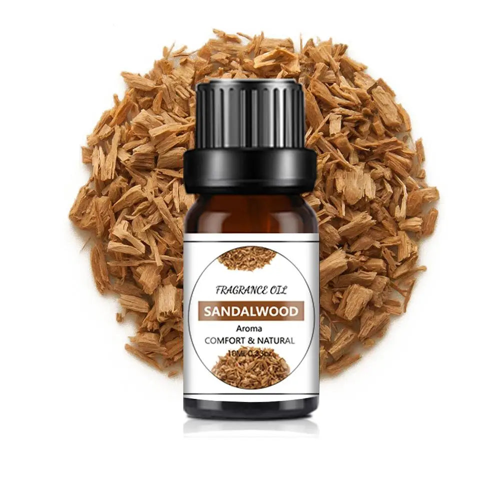 10ml amber glass bottle of Sandalwood fragrance oil, resting on a pile of natural wood shavings, white background.