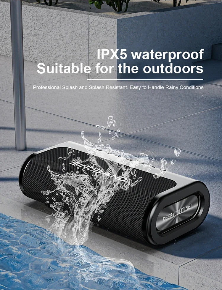 Black, portable 80W wireless Bluetooth speaker with an IPX5 waterproof design, shown being splashed with water.