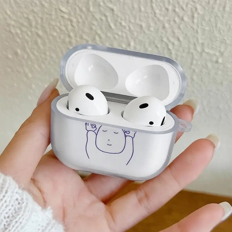 Clear silicone AirPods 3 case featuring a cute minimalist cartoon character design, held in a hand.