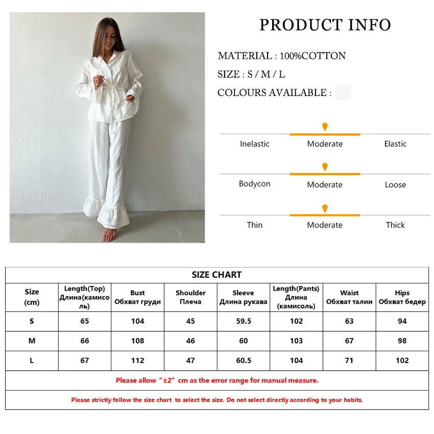 White cotton loungewear set featuring a button-down shirt with a waist tie and matching trousers with ruffled hems.