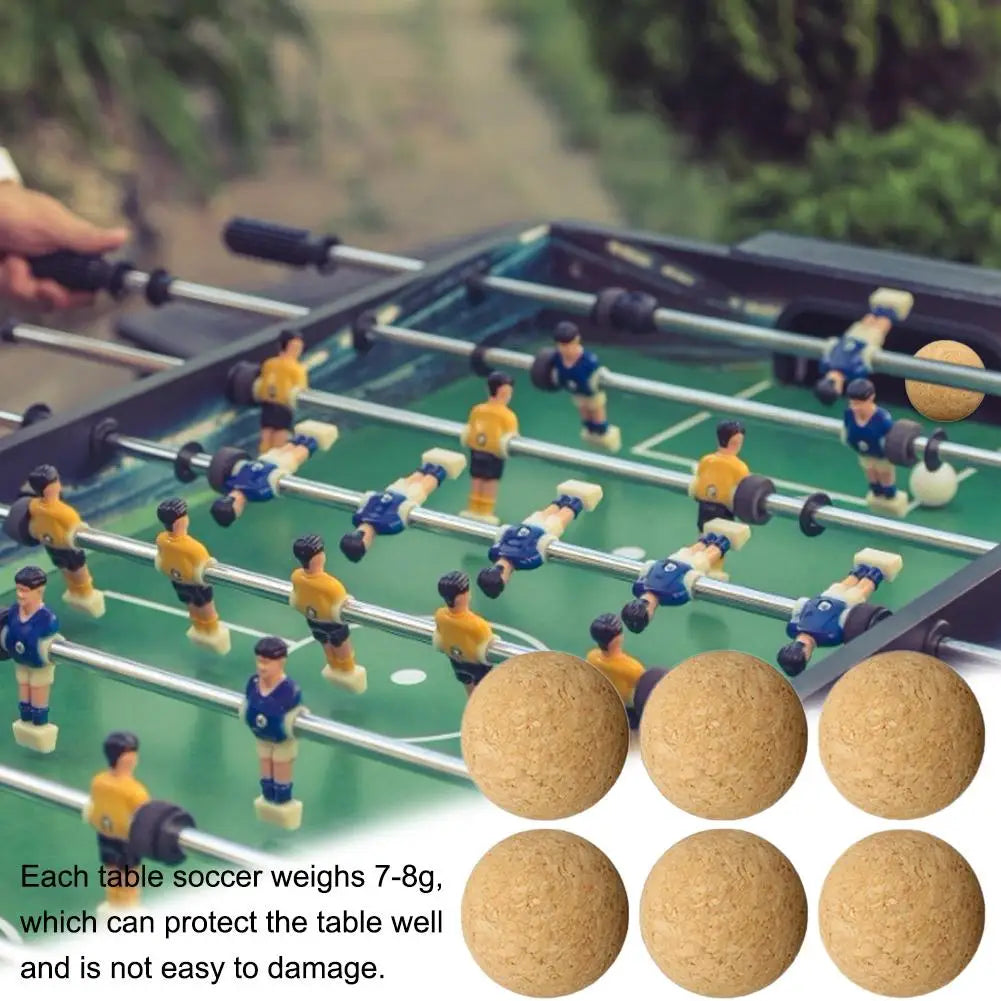 Table foosball game with blue and yellow players, featuring a set of six lightweight, durable textured cork balls.
