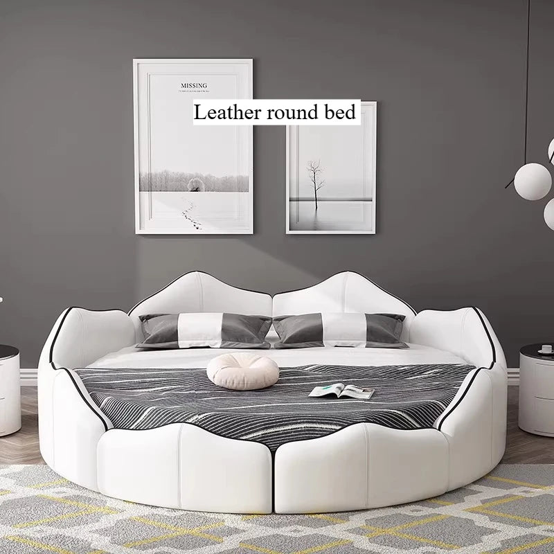 Luxury white faux leather round bed frame with a modern scalloped design and black trim detail.
