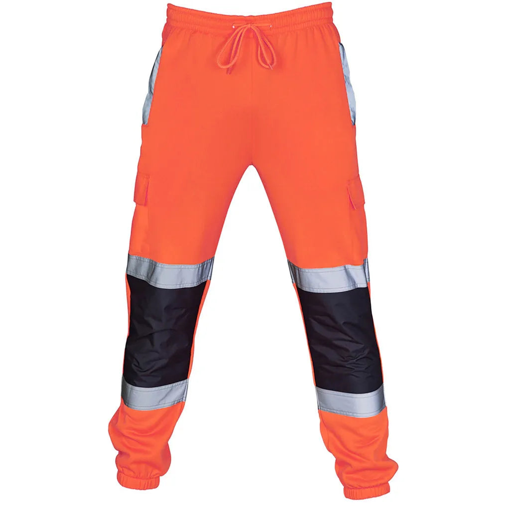 High-vis orange jogger-style work trousers with drawstring waist, black knee patches, and reflective leg stripes.