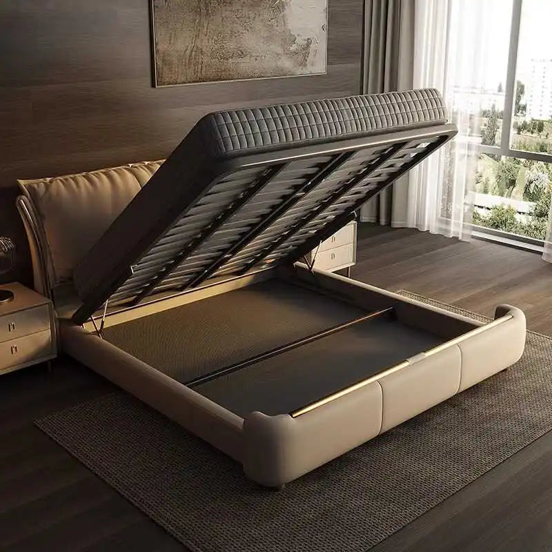 Modern beige double ottoman bed with a lift-up storage base and a soft, curved upholstered frame.