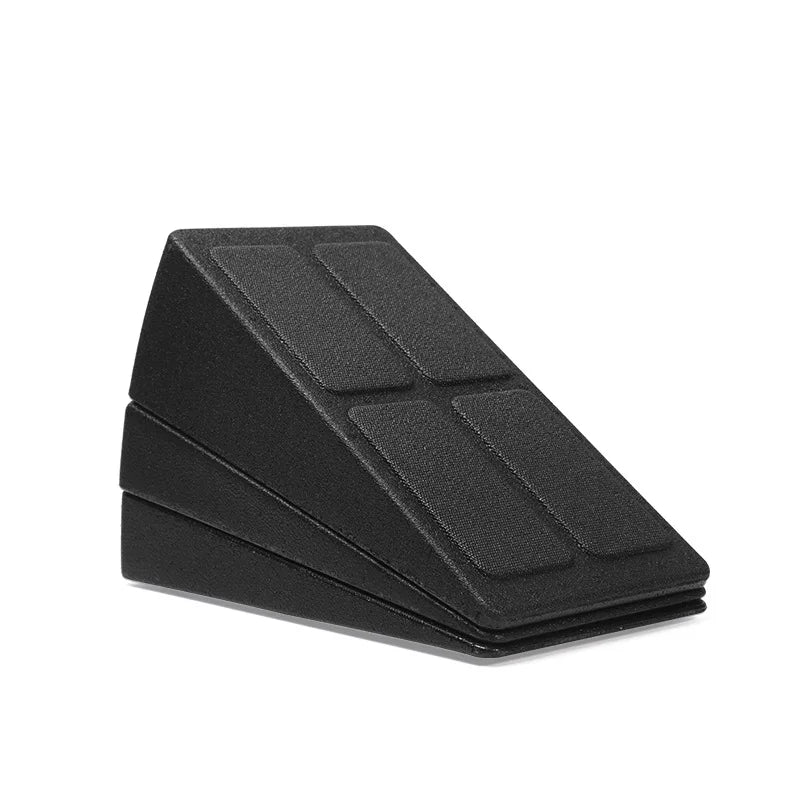 Black adjustable squat wedge block with a textured anti-slip surface, isolated against a white background.